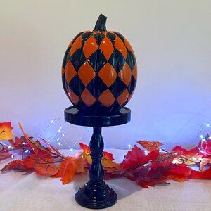 Halloween 13.5 inch orange and black checkerboard resin pumpkin on pedastal